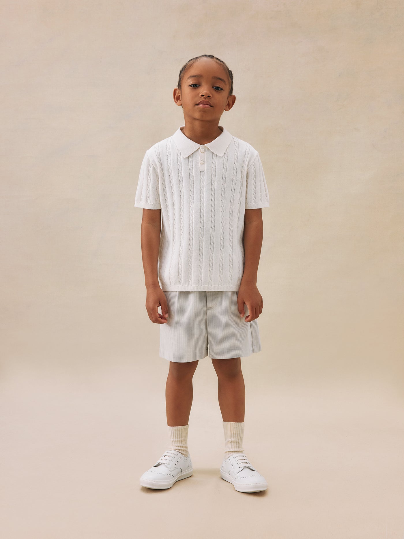 Look de niño verano 2025 Polo de punto trenzado