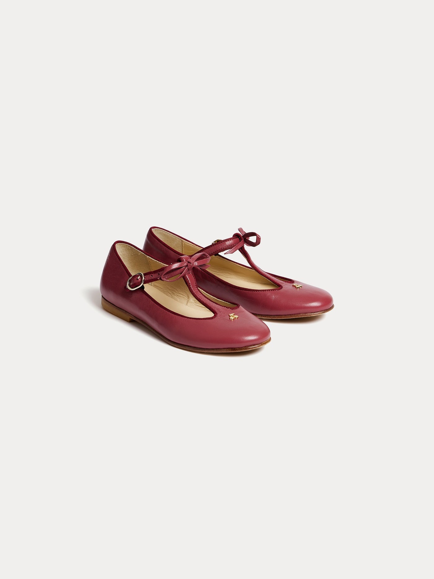 Joyce salomés in burgundy and cherry gold leather