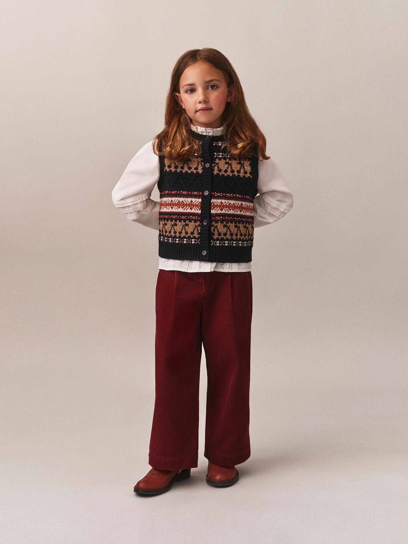 Look invernale per bambina 2025 - Maglione senza maniche