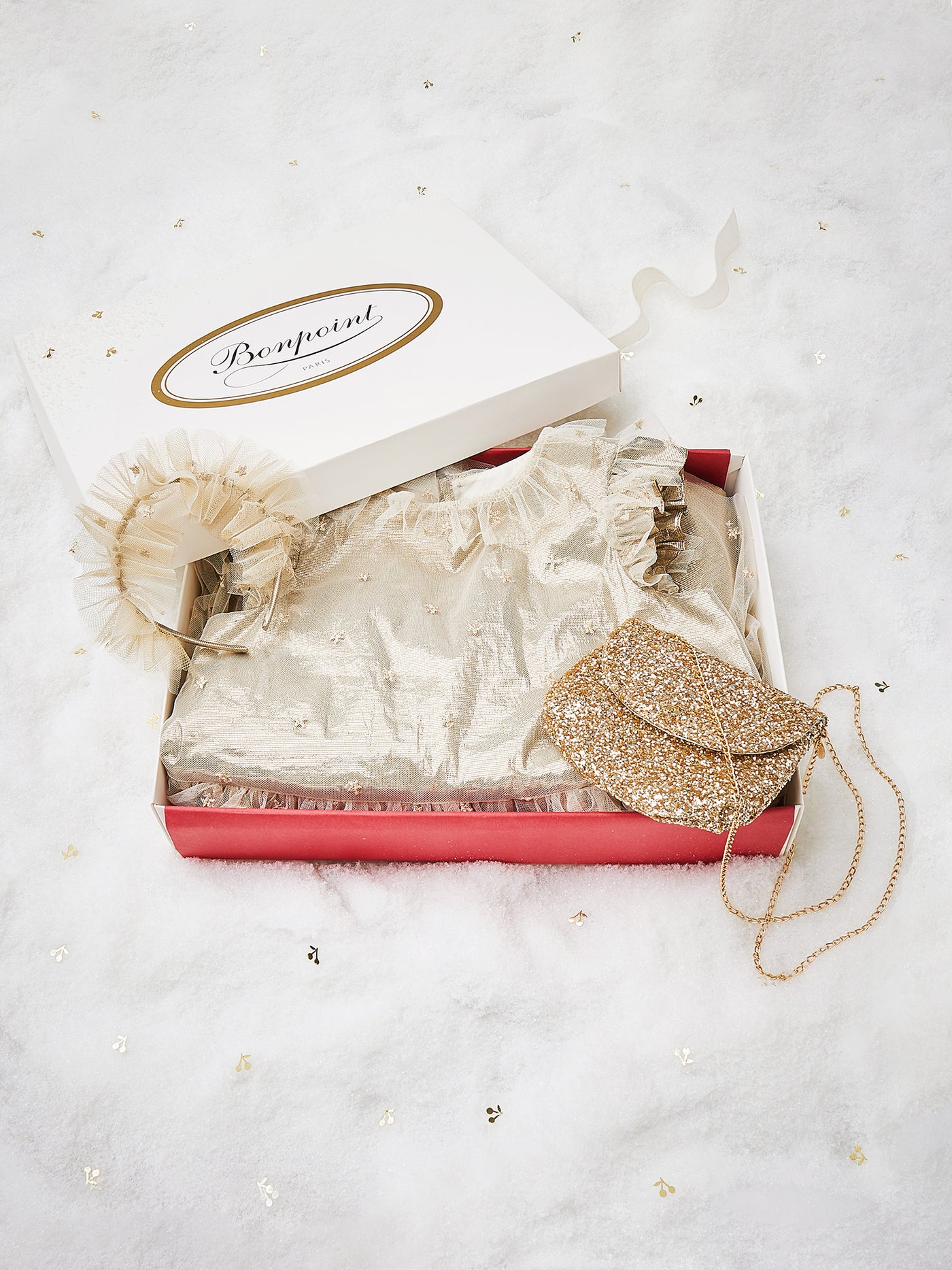 Caja regalo de Navidad con vestido y accesorios dorados de niña