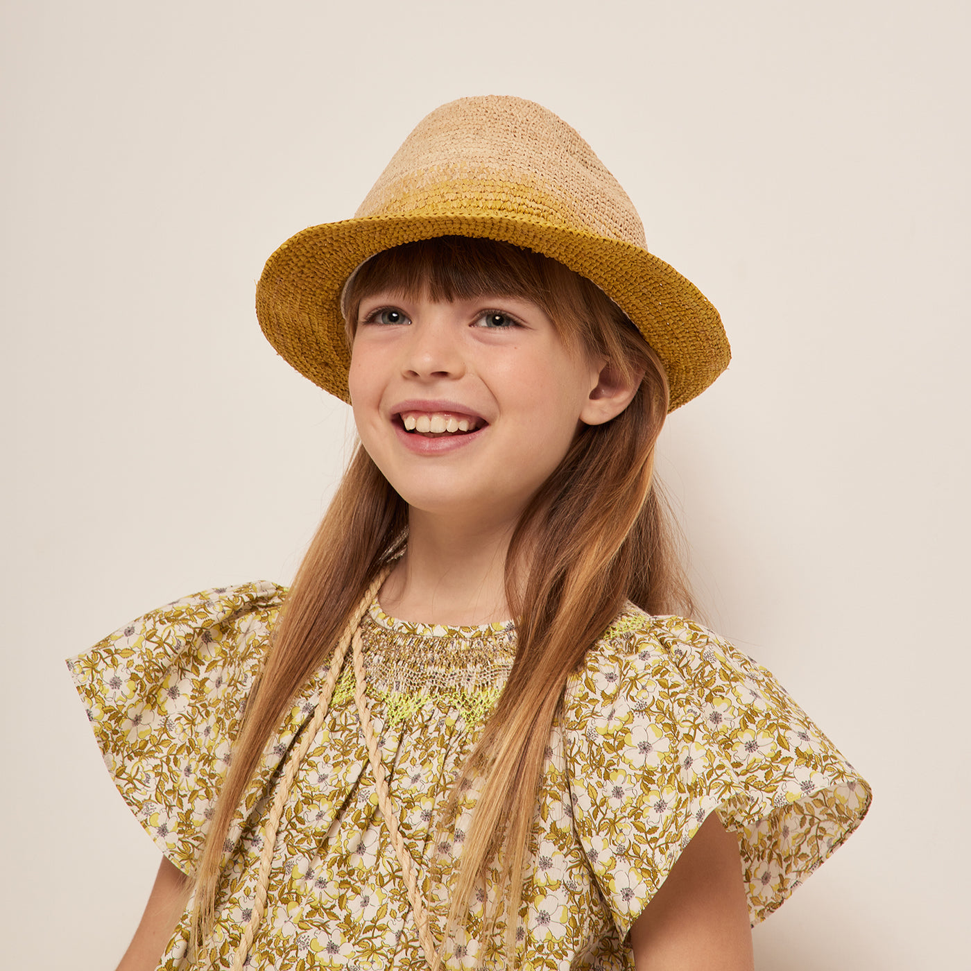 Bonpoint Cruise collection printed yellow dress and raphia bob 