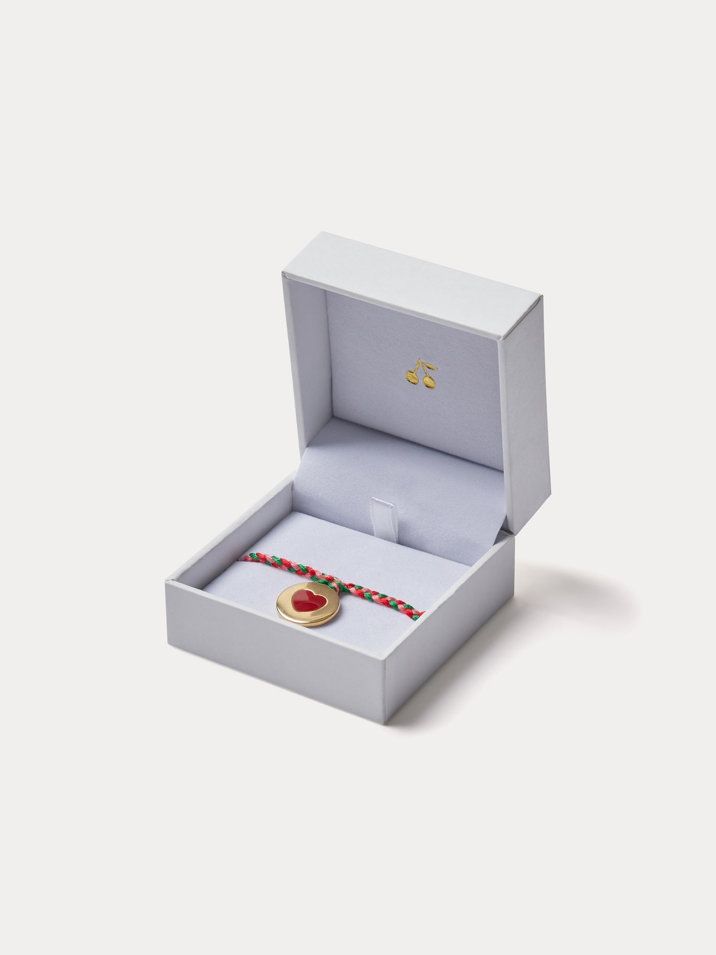 Bracelet tressé en coton avec médaille