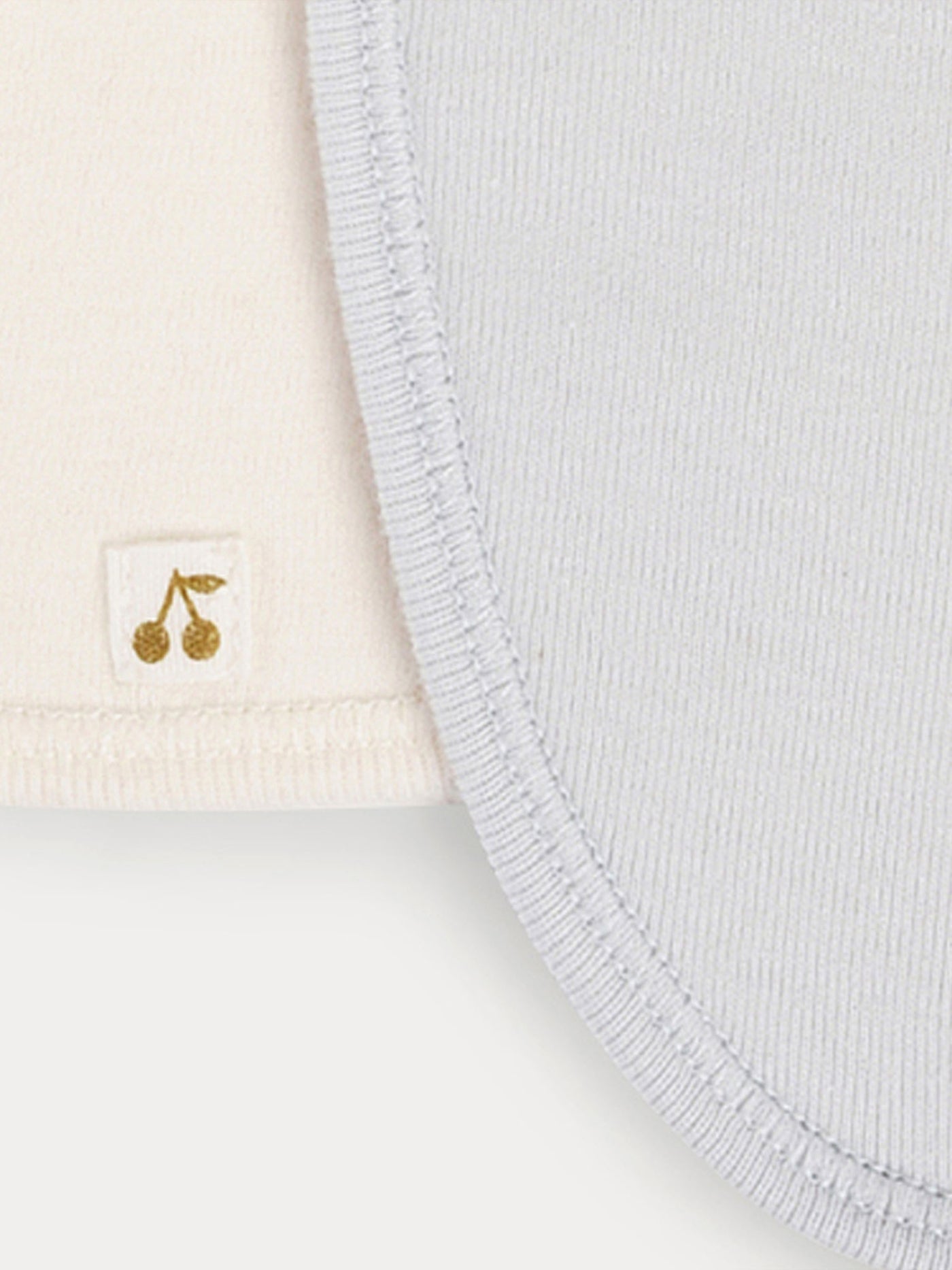 Set di tre bavaglini in cotone per neonato di colore celeste