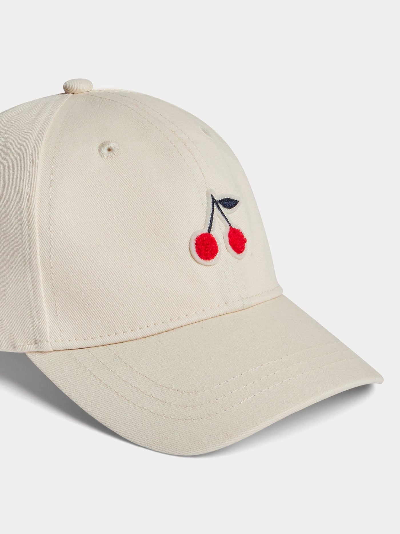 Cappellino regolabile con patch a ciliegia