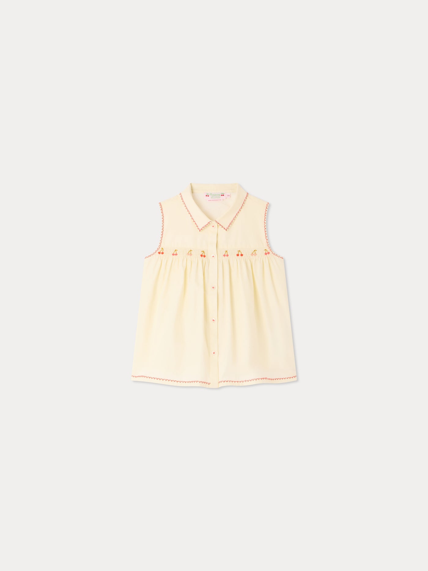 Camicetta Lexi con smock e ricami fatti a mano in cotone bio