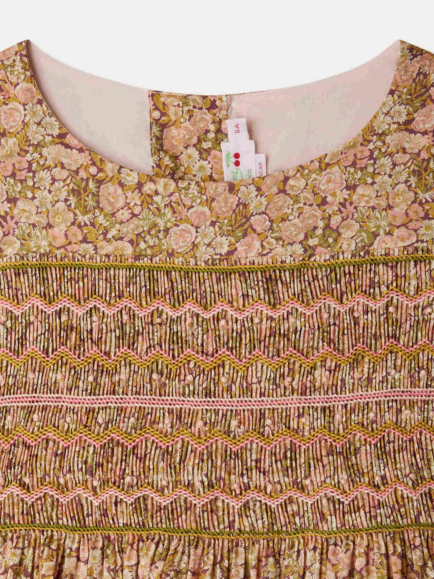 Smocked and embroidered Duchesse dress in Liberty fabric in organic cotton