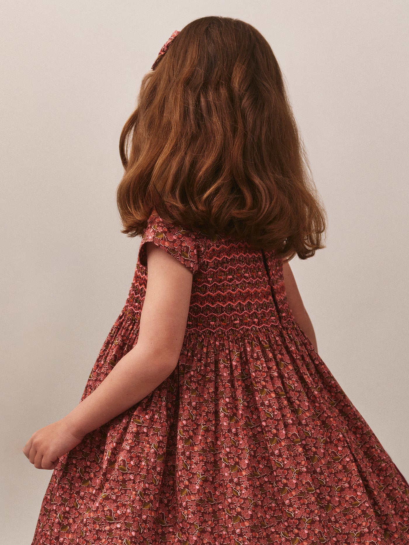 Smocked and embroidered Duchesse dress in Liberty fabric in organic cotton