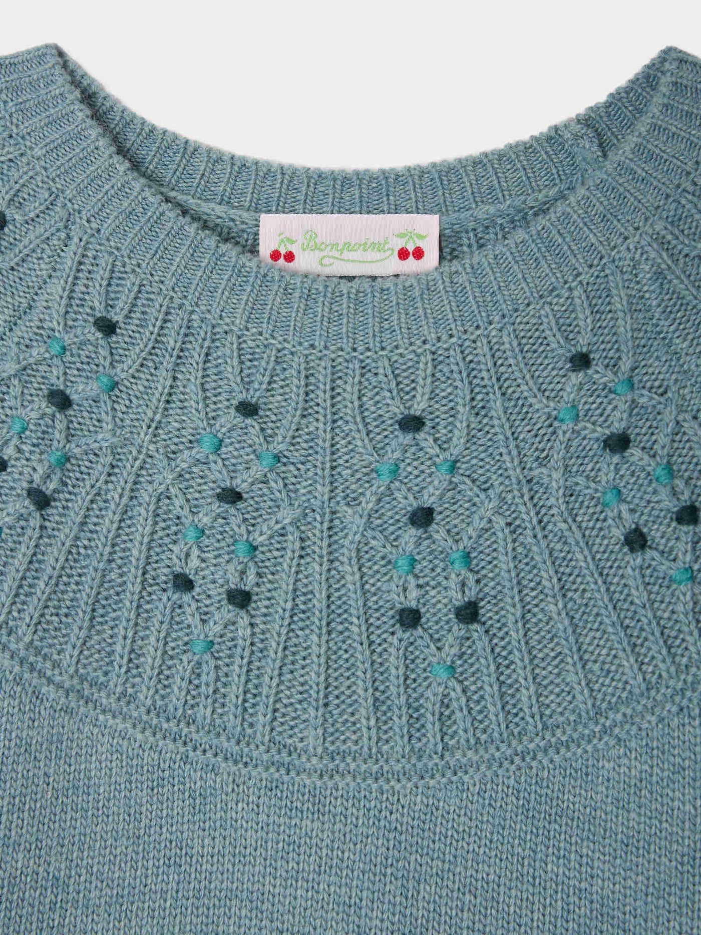 Pull Genièvre torsadé smocké et brodé en jacquard