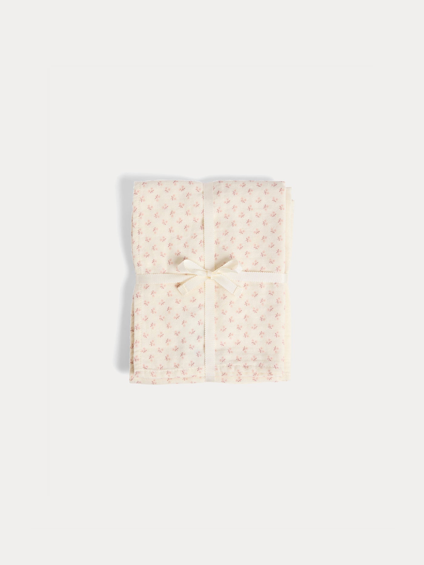 Set of plain and floral print cuddly swaddles in organic cotton