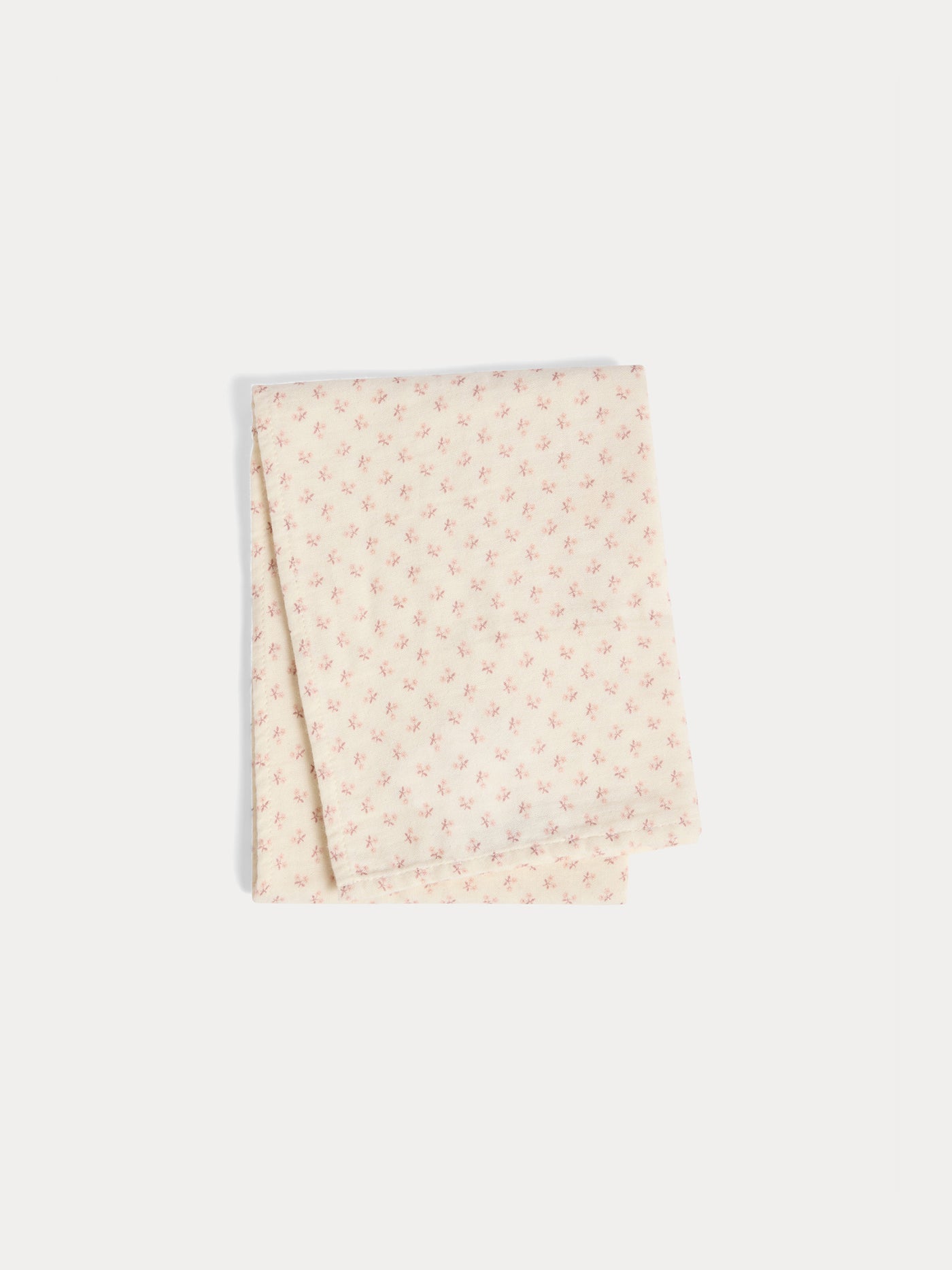 Set of plain and floral print cuddly swaddles in organic cotton