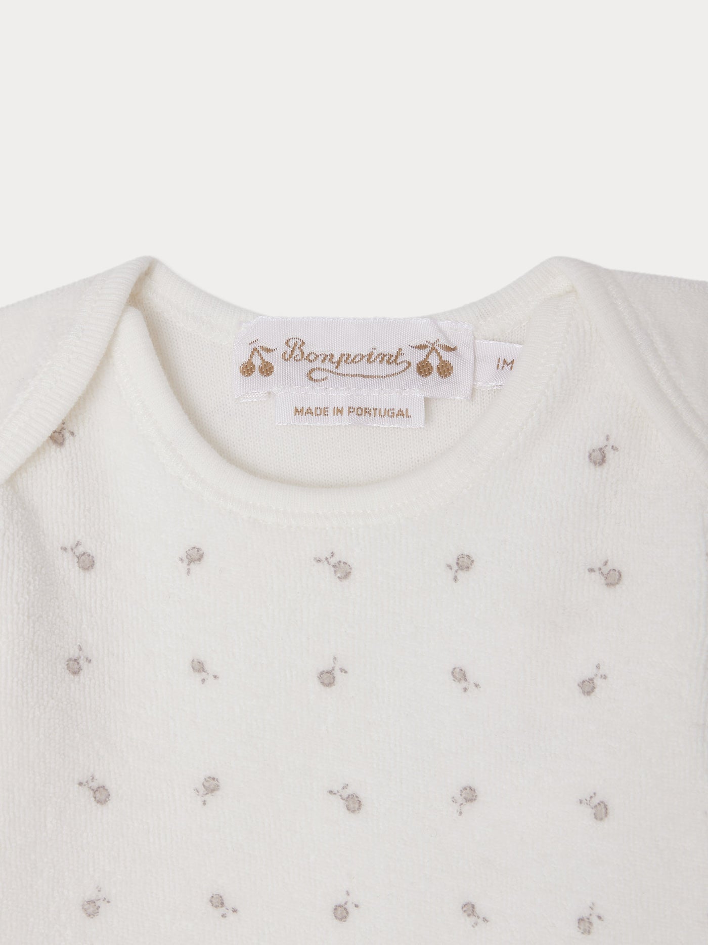 Completo Timi in spugna stampata con scollo all'americana in cotone biologico
