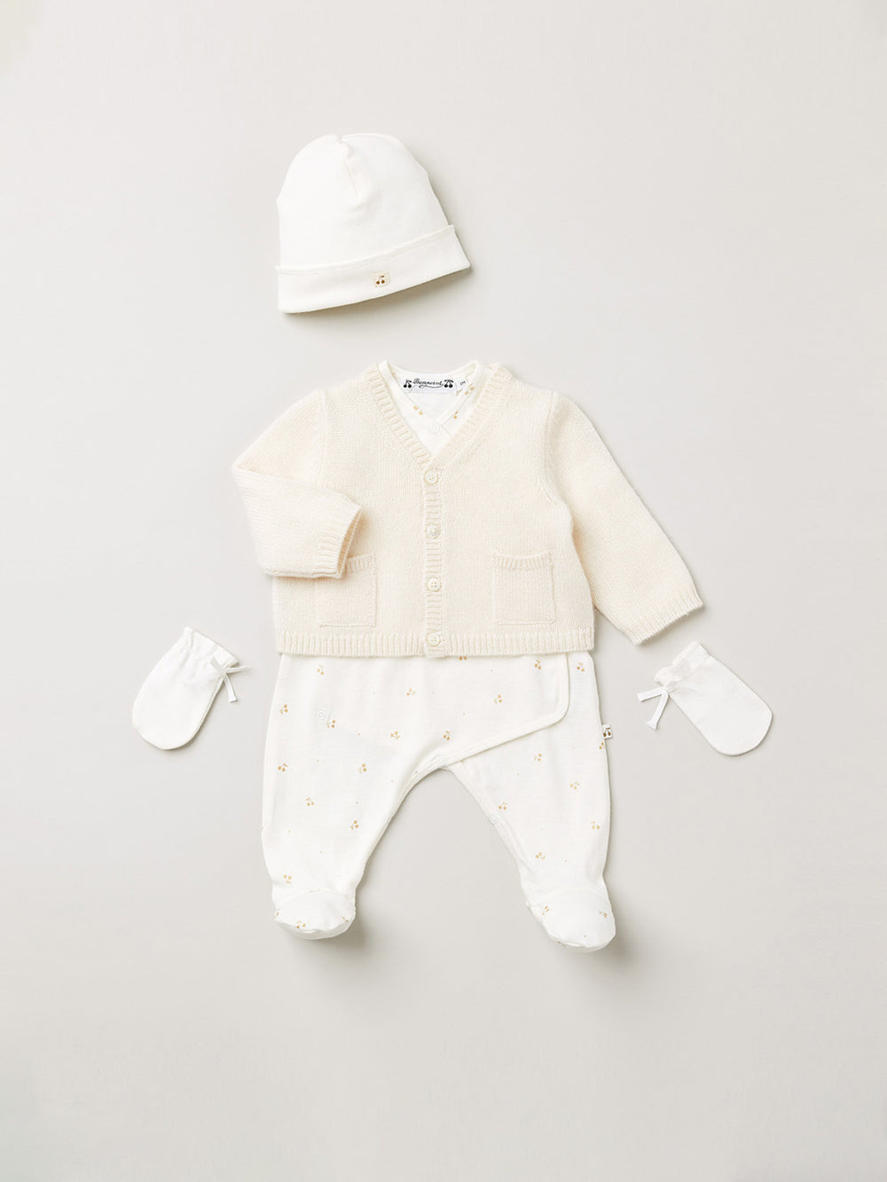 Cardigan bébé en cachemire blanc lait