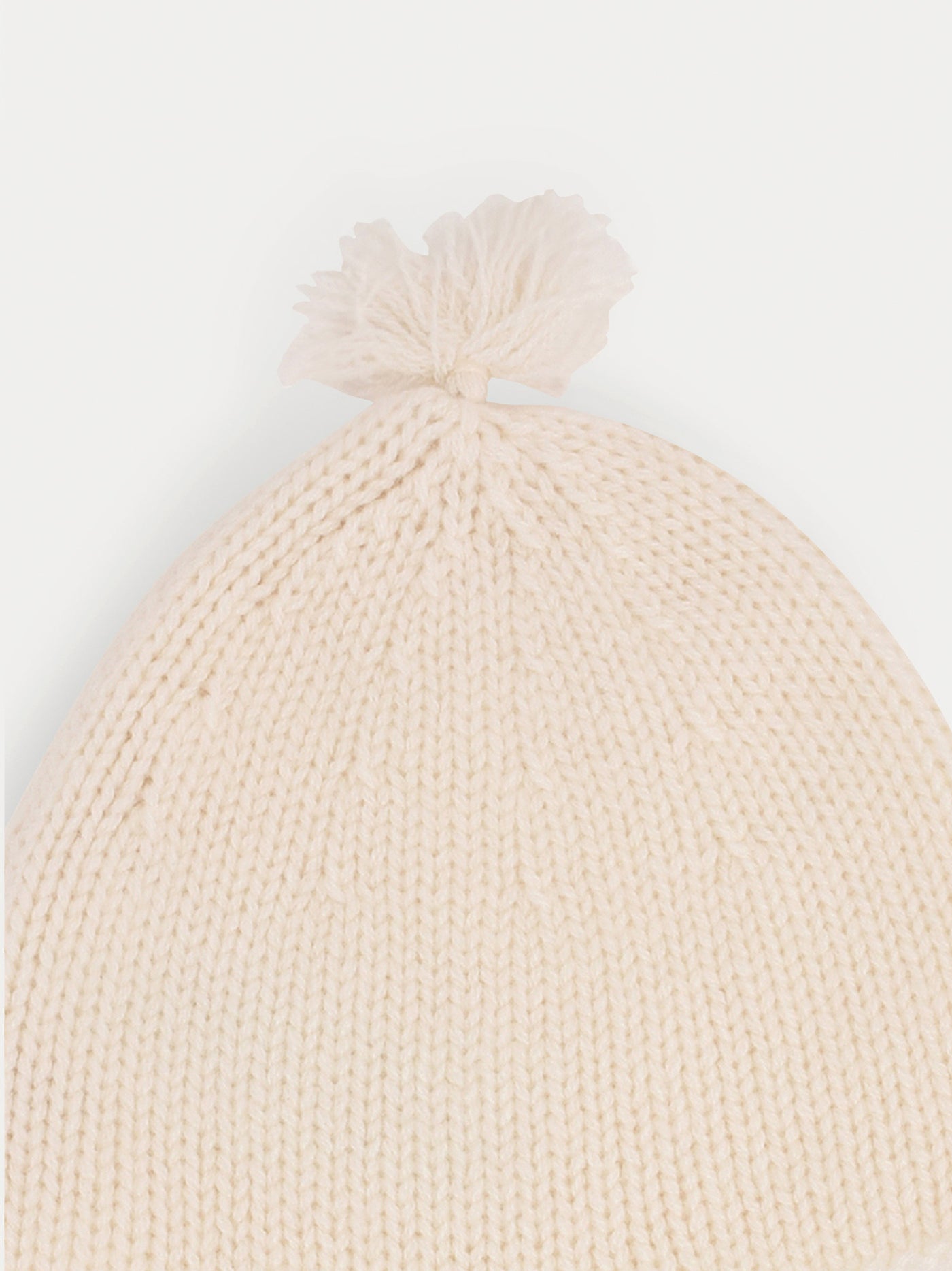 Babymütze aus Kaschmir in Milchweiß mit Pompons