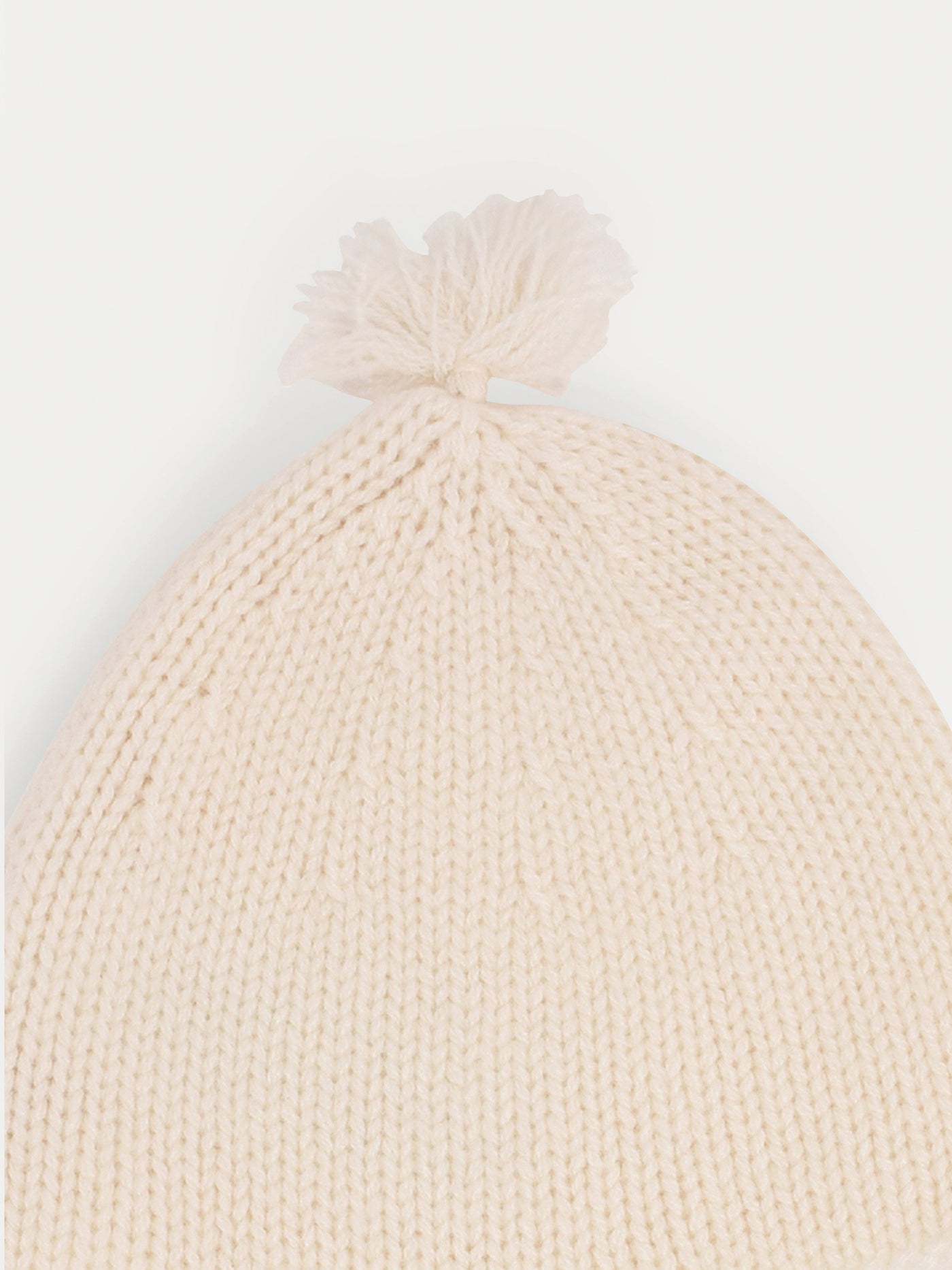 Babymütze aus Kaschmir in Milchweiß mit Pompons